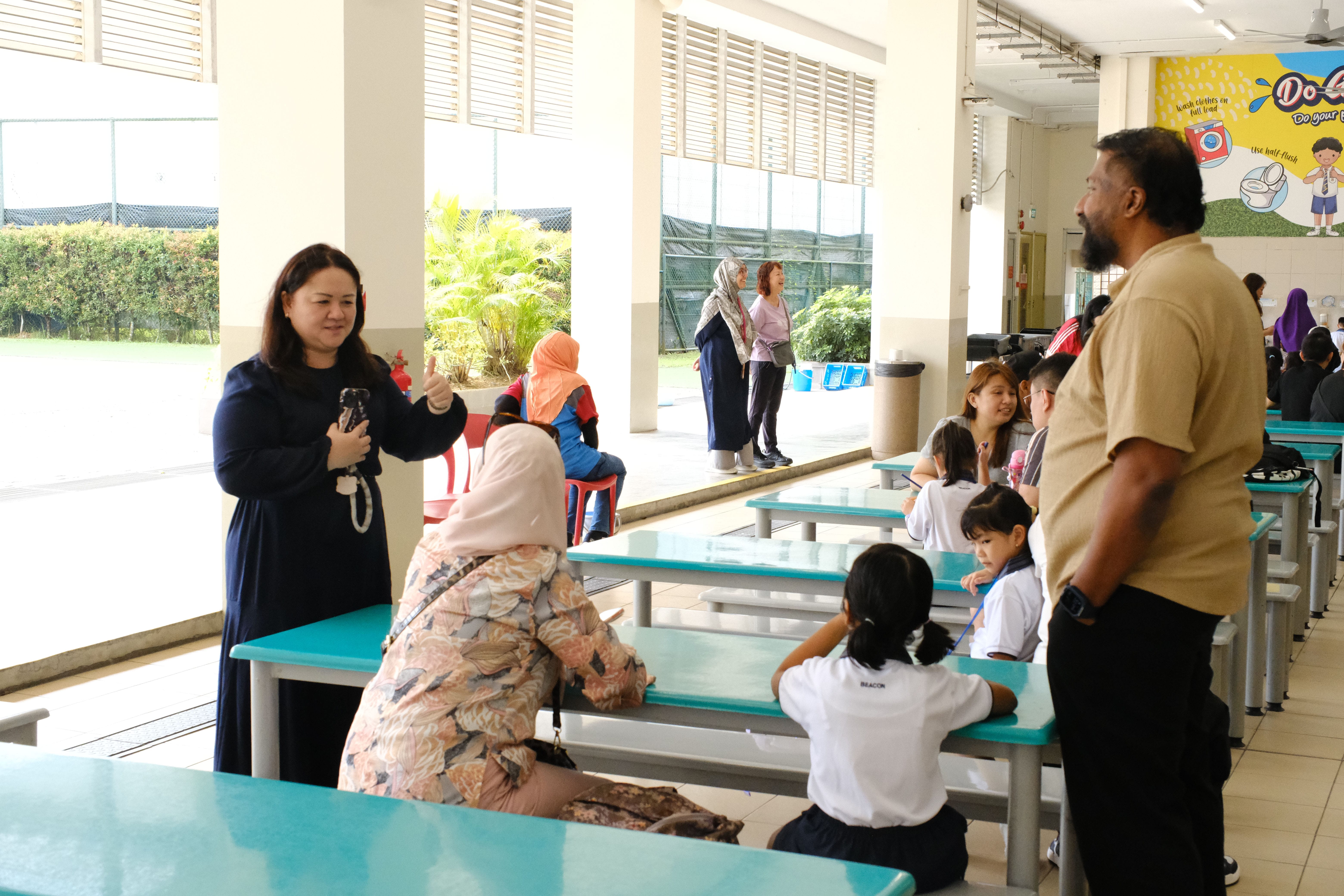Ms Ng talking to the parent